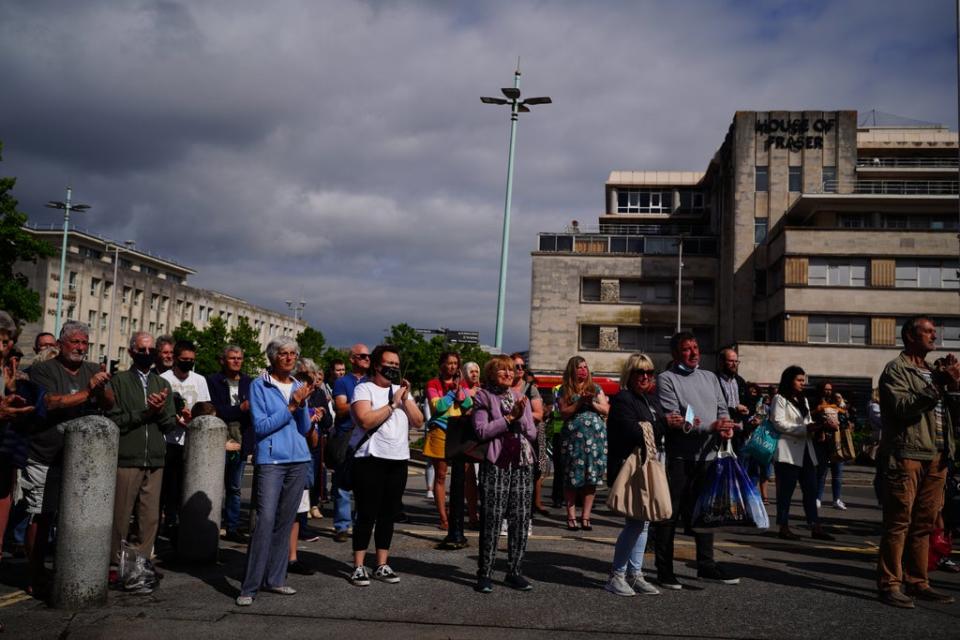 A large crowd gathered in Plymouth city centre to pay their respects to the victims of the Keyham shootings (Ben Birchall/PA) (PA Wire)