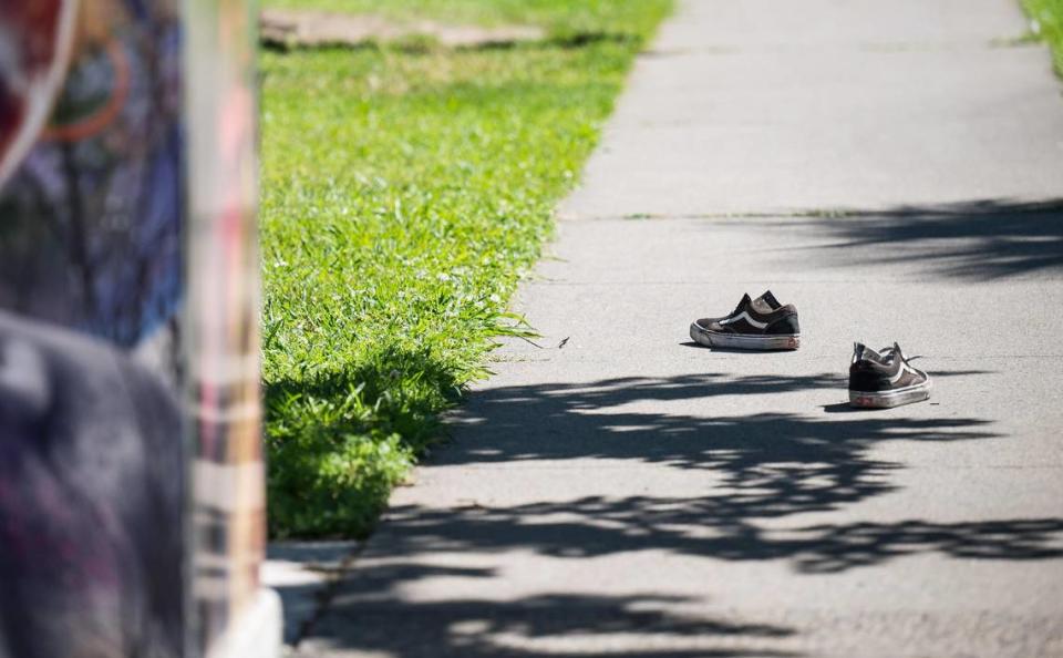 A pair of shoes believed to belong to a woman shot by Sacramento police are seen at Winn Park on Saturday, May 20, 2023, in midtown.
