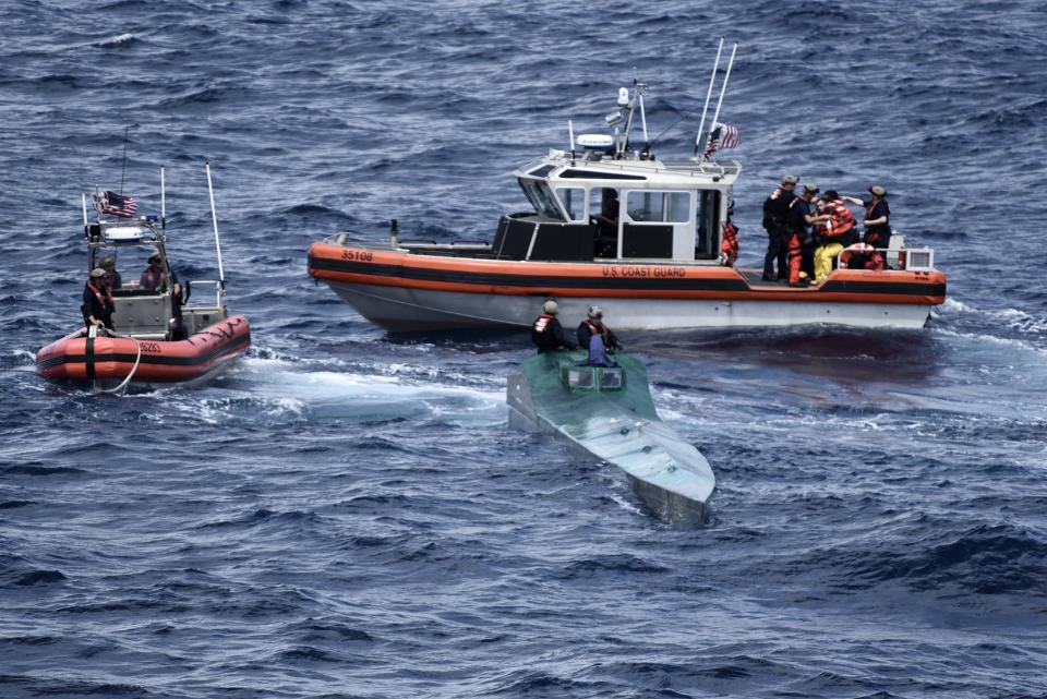 In this Nov. 4, 2019 photo provided by the U.S. Coast Guard, Coast Guard Cutter Bertholf (WMSL 750) boarding teams interdict a low-profile go-fast vessel while patrolling international waters of the Eastern Pacific Ocean, seizing more than 3,100 pounds of suspected cocaineAn estimated $312 million worth of cocaine seized from smugglers in the eastern Pacific Ocean has been brought to San Diego. About 18,000 pounds (8,165 kilograms) of the drug was offloaded Wednesday, Dec. 18, 2019, from the Coast Guard cutter Bertholf. (Petty Officer 2nd Class Paul Krug/U.S. Coast Guard via AP)