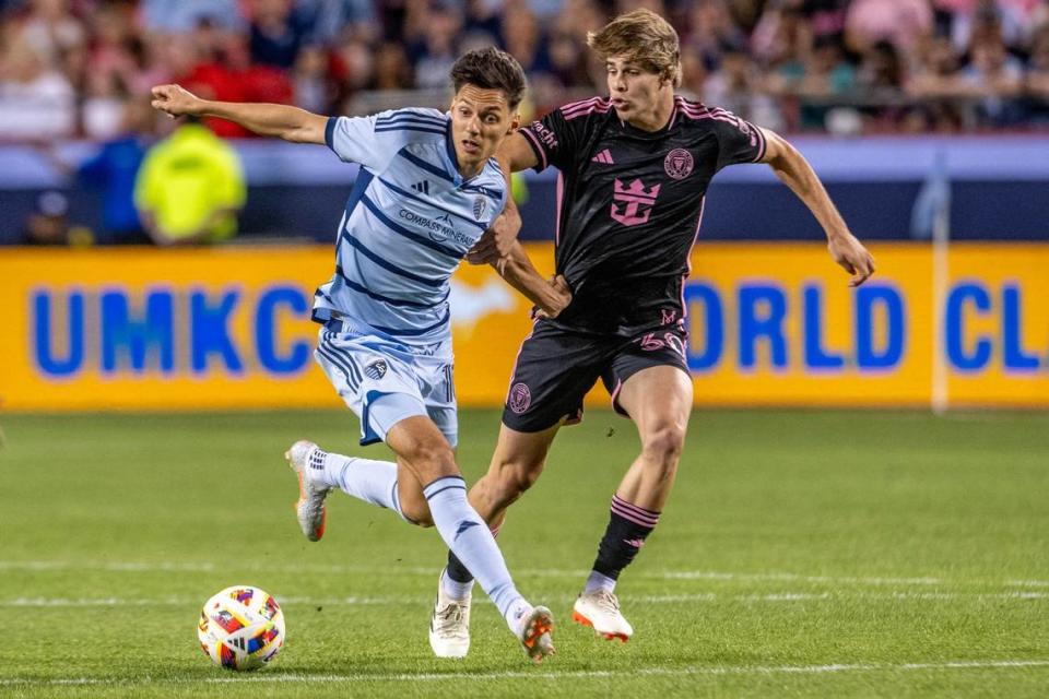 Sporting Kansas City forward Dániel Sallói (10) shields the ball from Inter Miami midfielder Benjamin Cremaschi (30) in the second half of an MLS game at GEHA Field at Arrowhead Stadium on Saturday, April 13, 2024, in Kansas City.