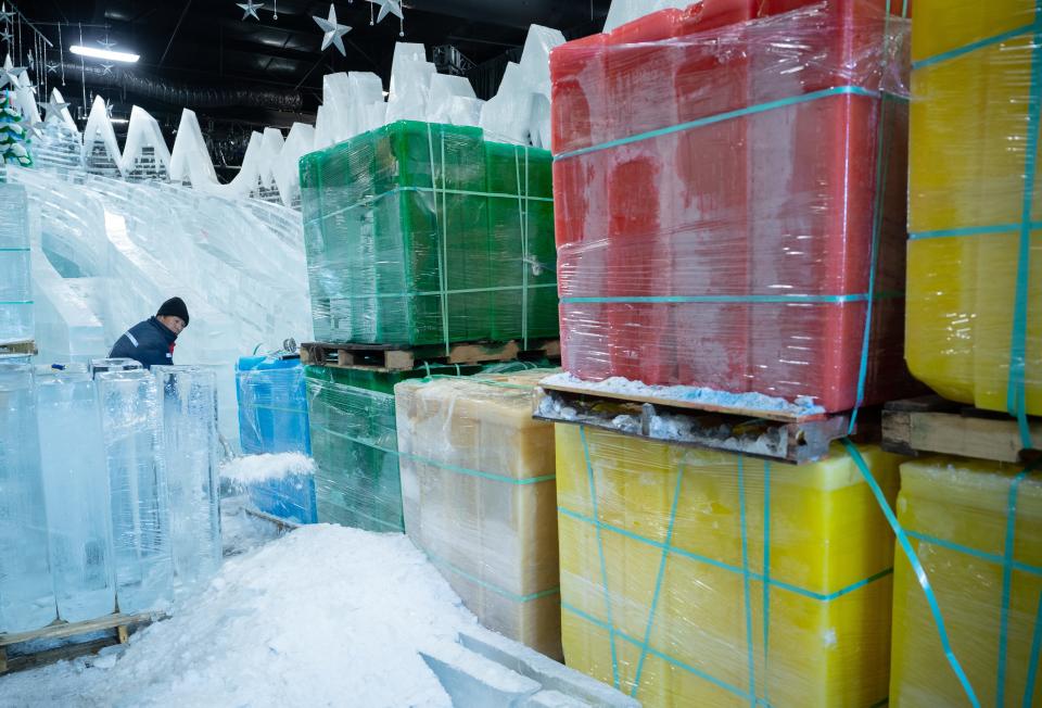 Wang Zhongyi of Harbin, China shovels shaved ice created by carving and scraping the massive blocks that will eventually be part of the ICE! featuring The Polar Express at Gaylord Opryland in Nashville, Tenn., Friday, Oct. 27, 2023.