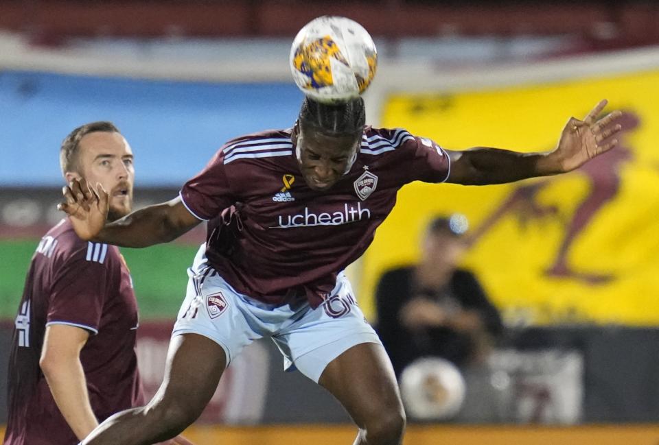 Colorado Rapids defender Moise Bombito (64) heads the ball during the first half of the team's MLS soccer match against the Vancouver Whitecaps on Wednesday, Sept. 27, 2023, in Commerce City, Colo. (AP Photo/Jack Dempsey)