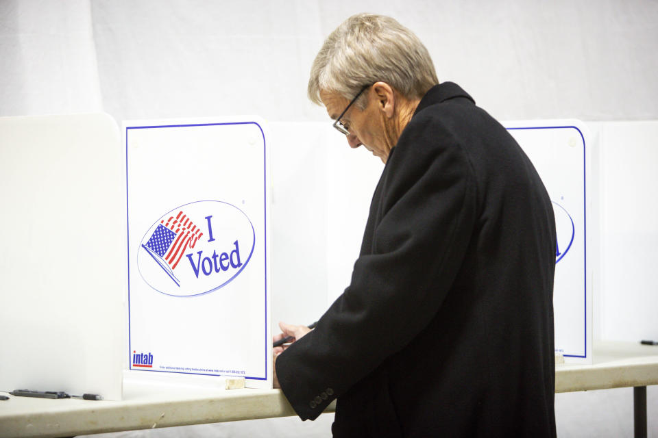 Republican gubernatorial candidate Scott Jensen casts his vote at Laketown Town Hall Tuesday, Nov. 8, 2022, in Chaska, Minn. (AP Photo/Nicole Neri)