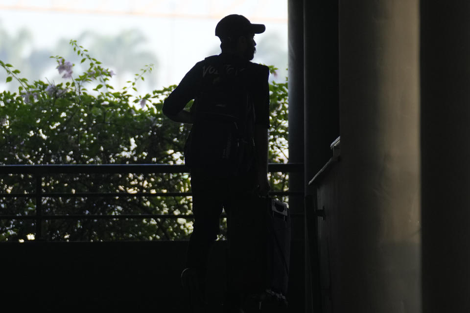 An Indian passenger who travelled in an unmarked Legend Airlines A340 from Vatry Airport in France, arrives at the Chhatrapati Shivaji Maharaj International Airport in Mumbai, India, Tuesday, Dec. 26, 2023. A charter plane that was grounded in France for a human trafficking investigation arrived in India with 276 Indians aboard early Tuesday, authorities said. The passengers had been heading to Nicaragua but were instead blocked inside the Vatry Airport for four days in an exceptional holiday ordeal. (AP Photo/Rafiq Maqbool)