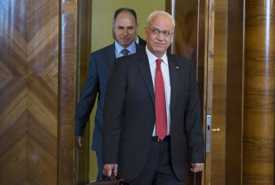 Palestinian negotiator, Saeb Erekat, foreground center, arrives for the talk with Russian Foreign Minister Sergey Lavrovf in Moscow, Russia, Tuesday, Aug. 19, 2014. Erekat&#39;s visit to Moscow is part of an effort to gain international support as Palestinian negotiators in Cairo try to hammer out a deal with Israel on the future of the war-torn Gaza Strip. (AP Photo/Alexander Zemlianichenko)