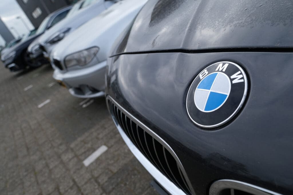 A logo of German carmaker BMW is pictured on the company’s vehicle parked outside its dealer on April 26, 2020 in Noordwijk, Netherlands. (Photo by Yuriko Nakao/Getty Images)