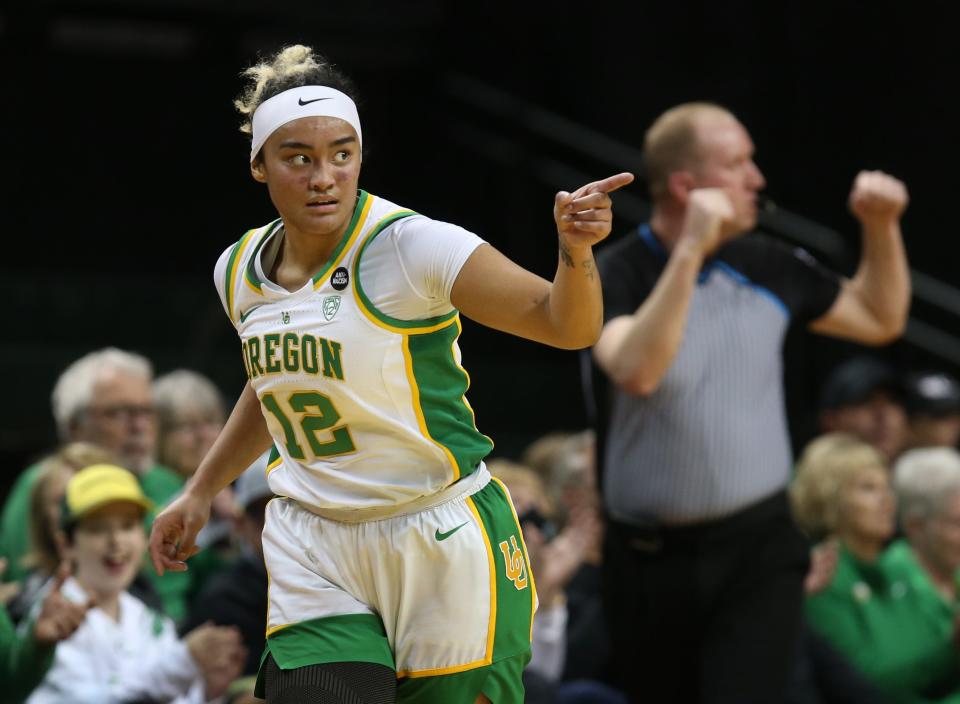 Oregon's Te-Hina Paopao points to her teammates after sinking a 3-point shot against Rice during the first half of the 2023 WNIT second round game in Eugene March 20.