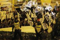 Demonstrators march during a protest in Lisbon March 6, 2014. REUTERS/Hugo Correia