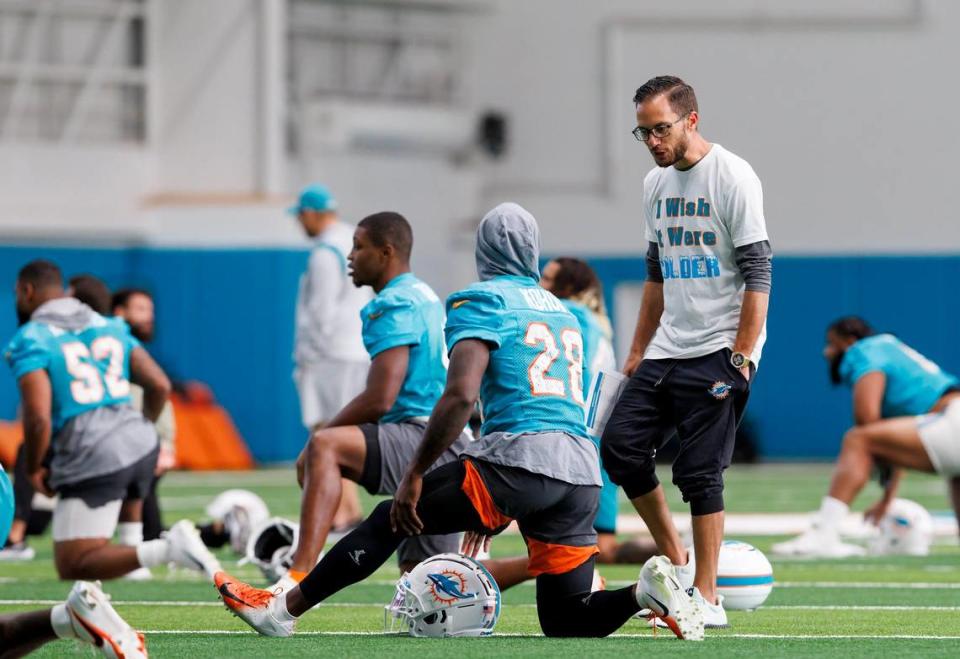 Miami Dolphins head coach Mike McDaniel talks to Dolphins cornerback Kader Kohou during practice at Baptist Health Training Complex in Hard Rock Stadium on Wednesday, December 14, 2022 in Miami Gardens, Florida.