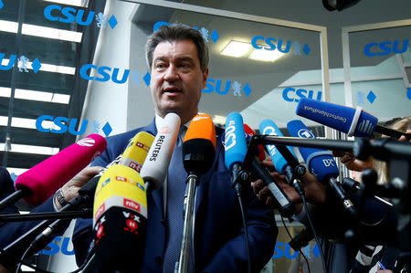 Bavarian Prime Minister Markus Soeder speaks to the media before a Christian Social Union (CSU) board meeting in Munich, Germany, June 18, 2018. REUTERS/Ralph Orlowski