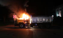 Aug 23, 2020; Kenosha, WI, USA; A city truck burns outside the Kenosha County Courthouse in Kenosha on Sunday, Aug. 23, 2020. Kenosha police shot a man Sunday evening, setting off unrest in the city after a video appeared to show the officer firing several shots at close range into the man's back. Mandatory Credit: Mike De Sisti/Milwaukee Journal Sentinel via USA TODAY NETWORK/Sipa USA