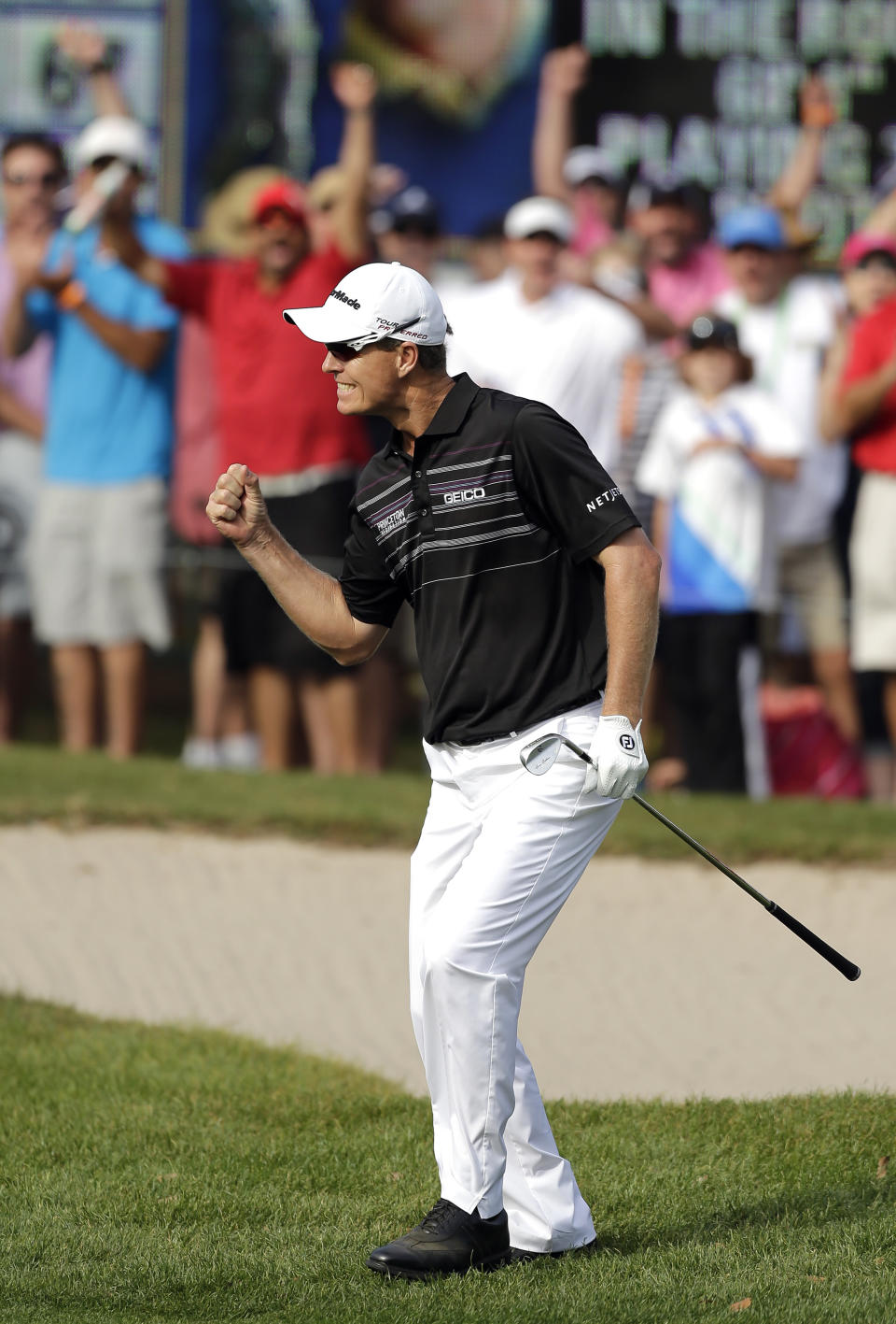 John Senden, of Australia, reacts after chipping in on the 16th hole during the final round of the Valspar Championship golf tournament at Innisbrook, Sunday, March 16, 2014, in Palm Harbor, Fla. Senden won the tournament. (AP Photo/Chris O'Meara)