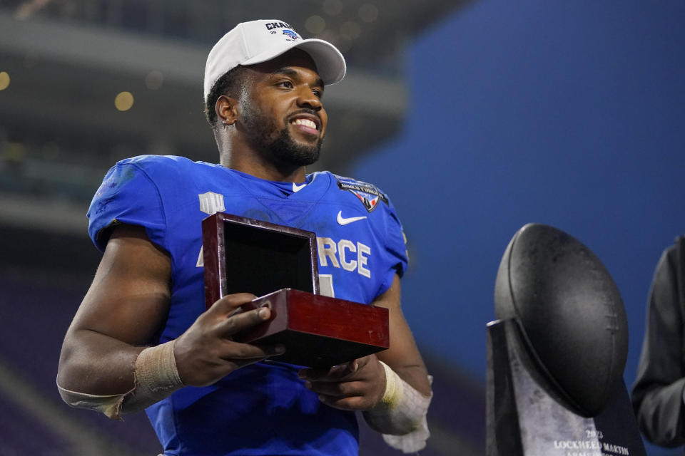 Air Force fullback Emmanuel Michel holds the Armed Forces Bowl most valuable player award following an NCAA college football bowl game against James Madison, Saturday, Dec. 23, 2023, in Fort Worth, Texas. Air Force won 31-21. (AP Photo/Julio Cortez)