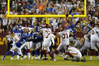 Washington Football Team kicker Dustin Hopkins (3) hits the winning field goal against the New York Giants at the end of an NFL football game, Thursday, Sept. 16, 2021, in Landover, Md. Washington won 30 - 29. (AP Photo/Al Drago)