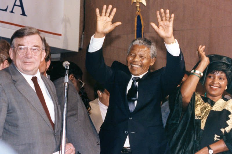 South African leader Nelson Mandela (C) and wife Winnie (R) wave to the crowd of supporters June 25, 1990. On February 11, 1990, Mandela was released after 27 years in prison. File Photo by Martin Jeong/UPI