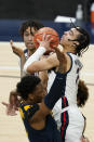 Gonzaga's Andrew Nembhard (3) shoots against West Virginia's Gabe Osabuohien (3) during the second half of an NCAA college basketball game Wednesday, Dec. 2, 2020, in Indianapolis. (AP Photo/Darron Cummings)