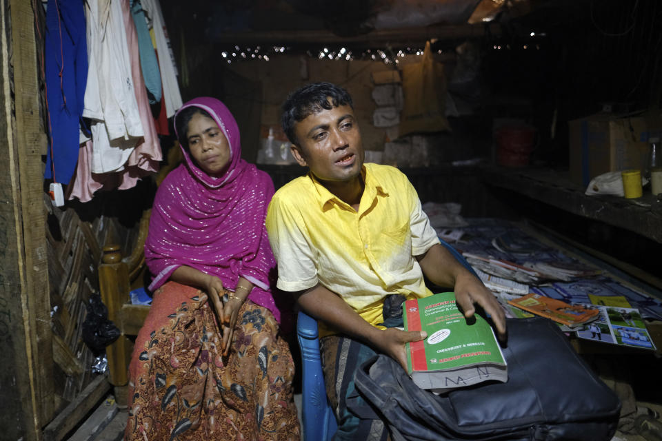 Muhammed Rashid and his wife, Dildar Begum, grieve for their 16-year-old son, Saiful Islam, at the Nayapara refugee camp in the Cox's Bazar district of Bangladesh, on March 7, 2023. (AP Photo/Mahmud Hossain Opu)