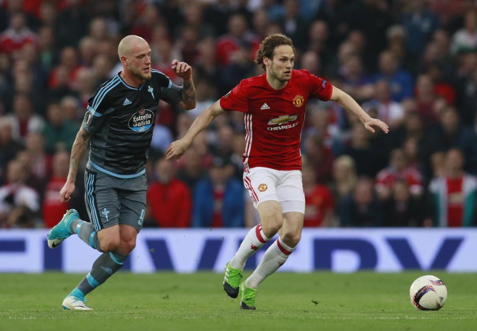 <p>Manchester United’s Daley Blind in action with Celta Vigo’s John Guidetti </p>