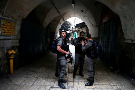 Israeli security forces stand at the site where an Israeli was wounded in a stabbing attack in Jerusalem’s Old City, Israeli Police said, March 18, 2018. REUTERS/Ammar Awad