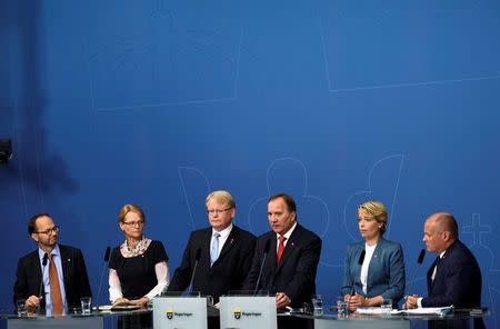 (L-R) Sweden's Infrastructure Minister Thomas Eneroth, Migration Minister Helene Fritzon, Defence Minister Peter Hultqvist, Prime Minister Stefan Lofven, Social Security Minister Annika Strandhall, and Minister for Home Affairs and Justice Morgan Johansson attend a news conference at Rosenbad, the Swedish government headquarters, in Stockholm, Sweden July 27, 2017. TT News Agency/Erik Simander via REUTERS