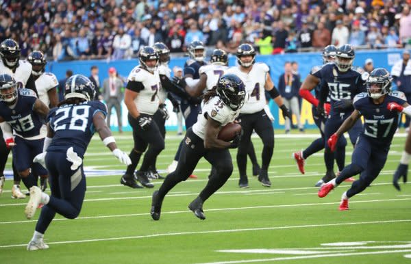 Baltimore Ravens running back Gus Edwards (C) runs against the Tennessee Titans on Sunday in London. Photo by Hugo Philpott/UPI