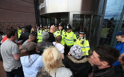 Police block protesters from the entrance to Alder Hey Children's Hospital in Liverpool where Alfie's life support was turned off - Credit: Peter Bryne/PA