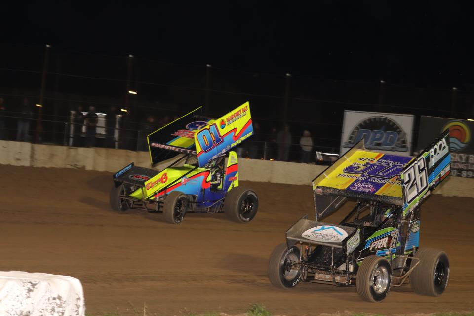 Bryan Sebetto, top, battles Jamie Miller for the win Saturday at Fremont Speedway.