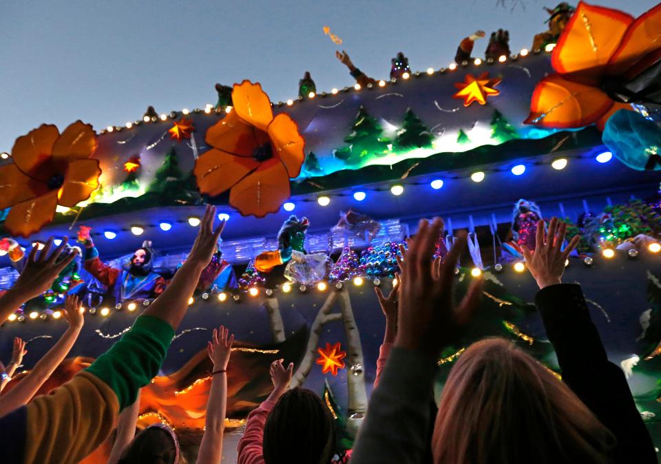 Revelers scream for beads during the Krewe of Endymion Mardi Gras parade in New Orleans, Saturday, Feb. 25, 2017. Endymion extended an offer to Mel Gibson to be its Grand Marshal for 2023, then rescinded the offer due to public outcry over Gibson's anti-Semitic and racist comments. (AP Photo/Gerald Herbert)