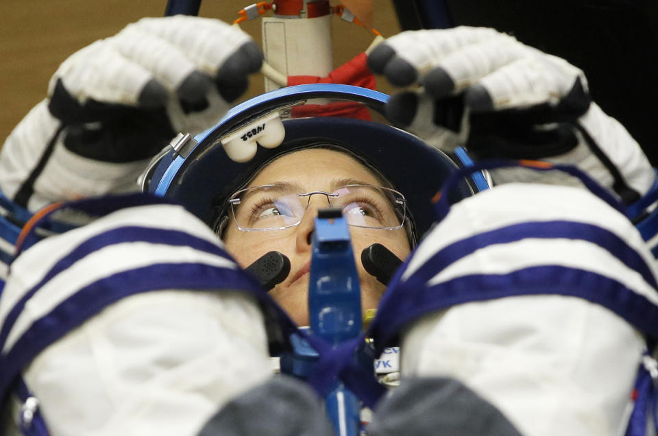 U.S. astronaut Christina Hammock Koch, member of the main crew of the expedition to the International Space Station (ISS), looks on during inspecting her space suit prior the launch of Soyuz MS-12 space ship at the Russian leased Baikonur cosmodrome, Kazakhstan, Thursday, March 14, 2019. (AP Photo/Dmitri Lovetsky)