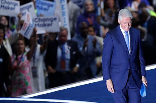 Clinton leaves the stage after making his speech. Photo: Getty.