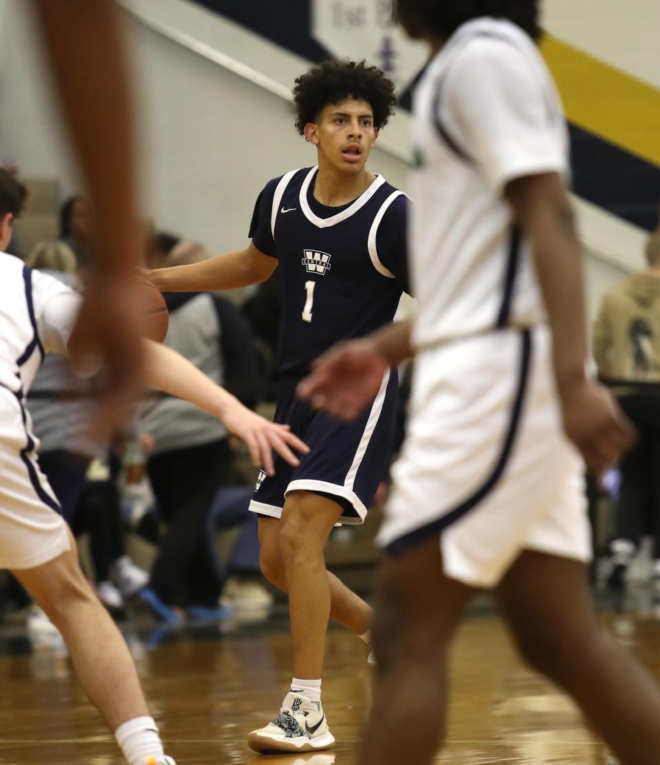 Warren Central’s Izayiah Villafuerte brings the ball up the court against Great Crossing.   Dec. 20