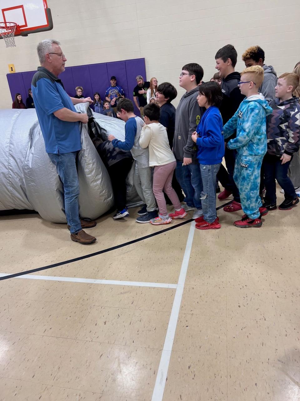 Students at B.L. Miller Elementary in Sebring line up to enter the mobile planetarium “Sky Dome” at family engagement night event held Thursday, April 11, 2024.