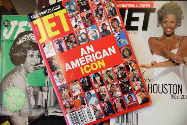 The final print edition of "Jet" magazine displayed with vintage copies of the magazine. Photo: Scott Olson/Getty Images