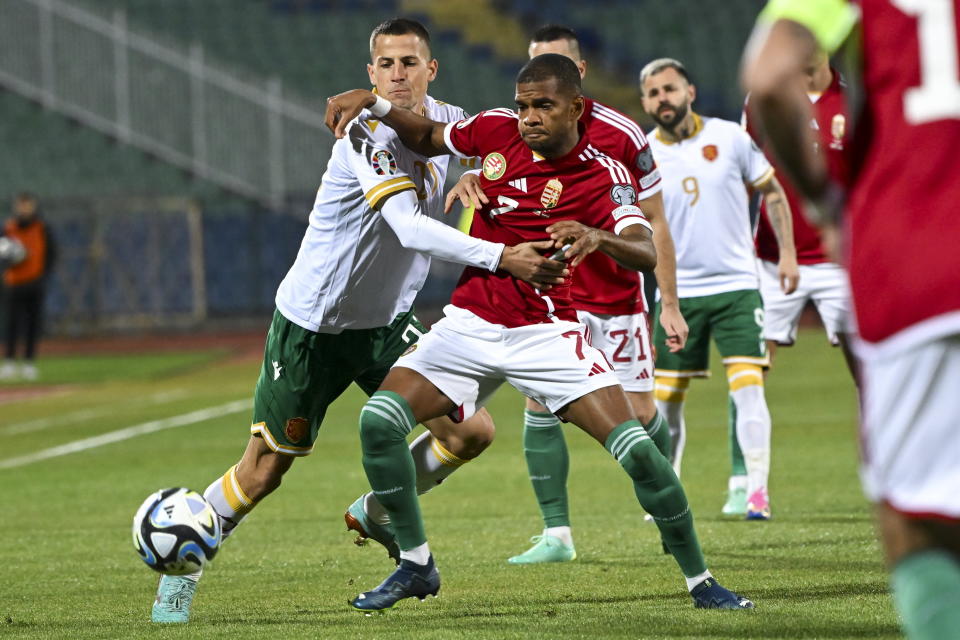 Hungary's Nego Loic, right, and Bulgaria'sMartin Minchev , left, challenge for the ball during the Euro 2024 group G qualifying soccer match between Bulgaria and Hungary at the Vasil Levski National Stadium in Sofia, Bulgaria, Thursday, Nov. 16, 2023. (Tibor Illyes/MTI via AP)