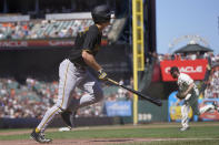 Pittsburgh Pirates' Bryan Reynolds, left, watches his three-run home run off of San Francisco Giants pitcher John Brebbia, right, during the seventh inning of a baseball game in San Francisco, Sunday, Aug. 14, 2022. (AP Photo/Jeff Chiu)