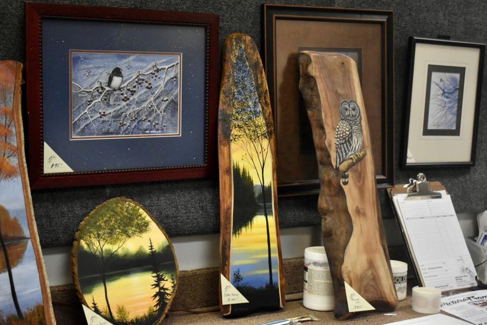 Michael Monroe also sells paintings on pieces of wood, many of which he sells at art shows like Art in the Park in Pinckney.