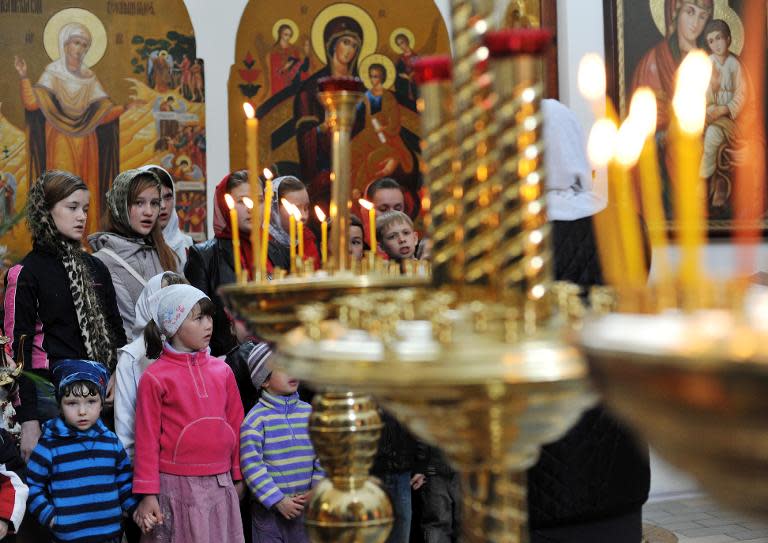 Children sing during a service in the cathedral of the eastern Ukrainian city of Slavyansk on April 19, 2014, on the eve Easter celebrations, the main religious holiday of the Orthodox church