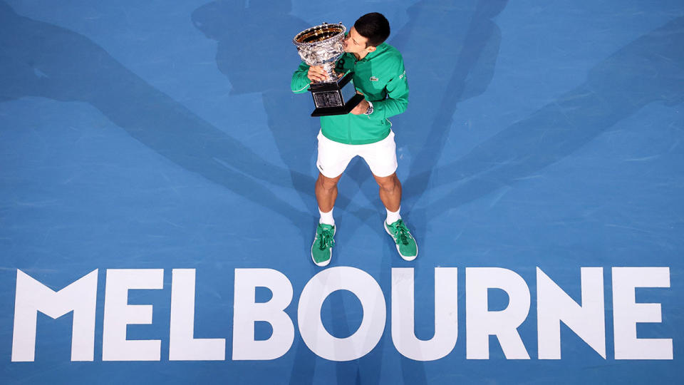 Pictured here, 2020 Australian Open champion Novak Djokovic poses with his trophy.