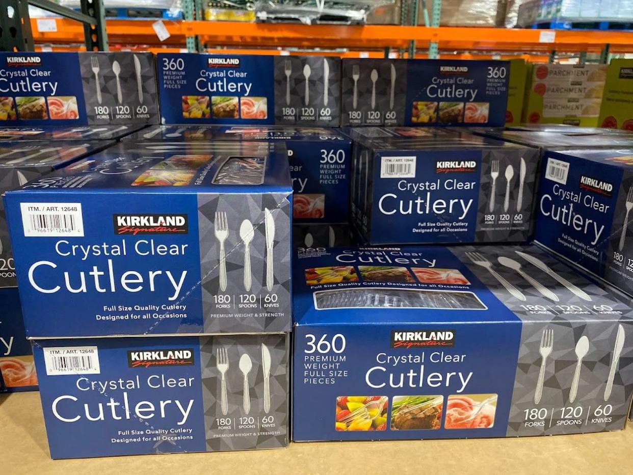 Packages of plastic disposable cutlery at Costco.