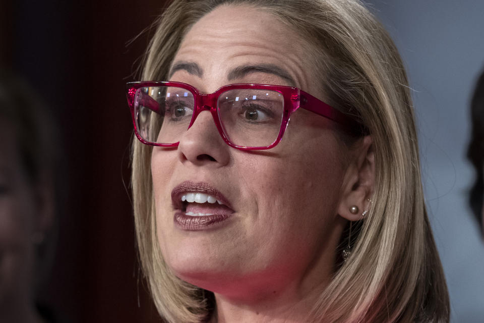 FILE - Sen. Kyrsten Sinema, D-Ariz., speaks to reporters following Senate passage of the Respect for Marriage Act, at the Capitol in Washington, Nov. 29, 2022. Sinema won Democrats a Senate seat from Arizona for the first time in a generation thanks in no small part to unity in her party and division among Republicans. Since then, Democrats have picked up the other Senate seat and won the top three state offices. But that winning formula is in jeopardy because of Sinema's estrangement and divorce from the Democratic Party, a situation that could complicate President Joe Biden's path to reelection and the party's hopes for maintaining control of the Senate. (AP Photo/J. Scott Applewhite, File)