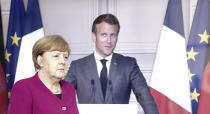 German Chancellor Angela Merkel arrives for a news conference with French President Emmanuel Macron, connected by video, after a joint video conference in Berlin, Germany, Monday, May 18, 2020. One topic was the corona pandemic and its consequences. (Kay Nietfeld/dpa via AP)