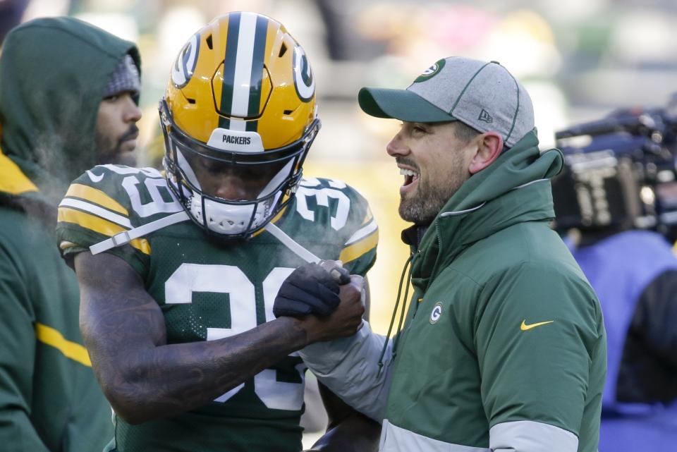 Green Bay Packers head coach Matt LaFleur talks to Chandon Sullivan before an NFL football game against the Chicago Bears Sunday, Dec. 15, 2019, in Green Bay, Wis. (AP Photo/Mike Roemer)