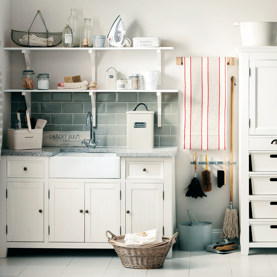 Cream utility room with cleaning supplies