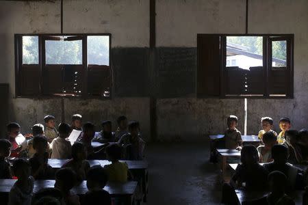 Rohingya children study in a government primary school in Byuhar Kone village, in Maungdaw town in northern Rakhine State November 10, 2014. REUTERS/Minzayar