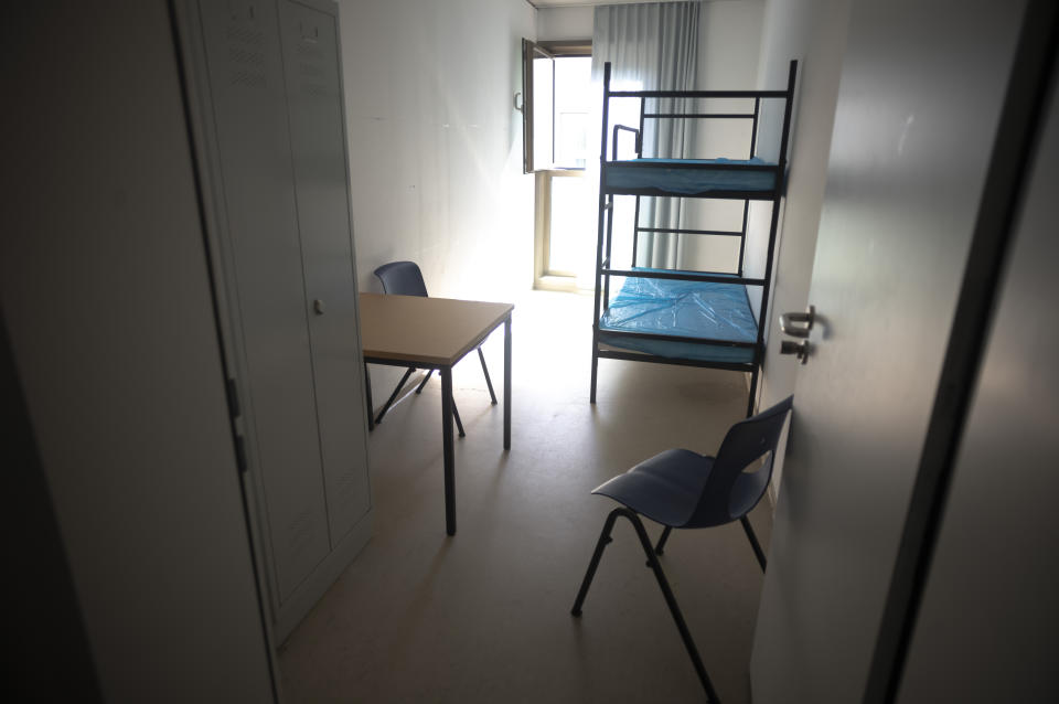 A view inside a standard two bed room inside a shelter for temporary accommodation for new asylum seekers near the central registration in Berlin, Germany, Monday, Sept. 25, 2023. Across Germany, officials are sounding the alarm that they are no longer in a position to accommodate migrants who are applying for asylum. (AP Photo/Markus Schreiber)