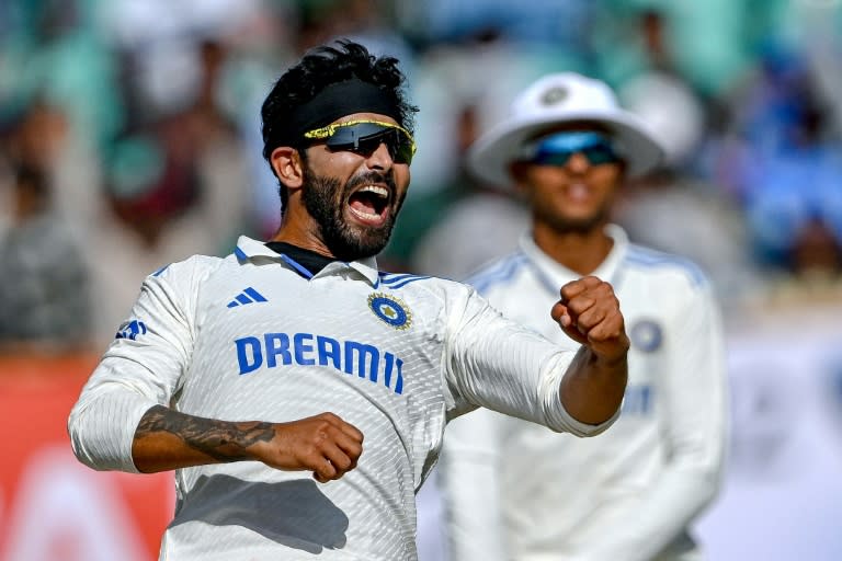 Spin king: India's Ravindra Jadeja celebrates after taking the wicket of <a class="link " href="https://sports.yahoo.com/soccer/teams/england-women/" data-i13n="sec:content-canvas;subsec:anchor_text;elm:context_link" data-ylk="slk:England;sec:content-canvas;subsec:anchor_text;elm:context_link;itc:0">England</a>'s Joe Root on Sunday (Punit PARANJPE)