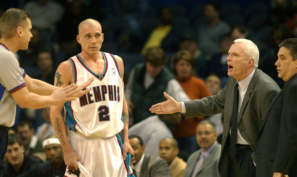 Memphis Grizzlies' head coach Hubie Brown (R) argues his first technical with official Steve Javie (L) during first quarter NBA action 18 February 2003 at the Pyramid in Memphis, TN. Brown was given a second technical and ejected from the game. AFP PHOTO/Matthew CRAIG (Photo by MATTHEW CRAIG / AFP)