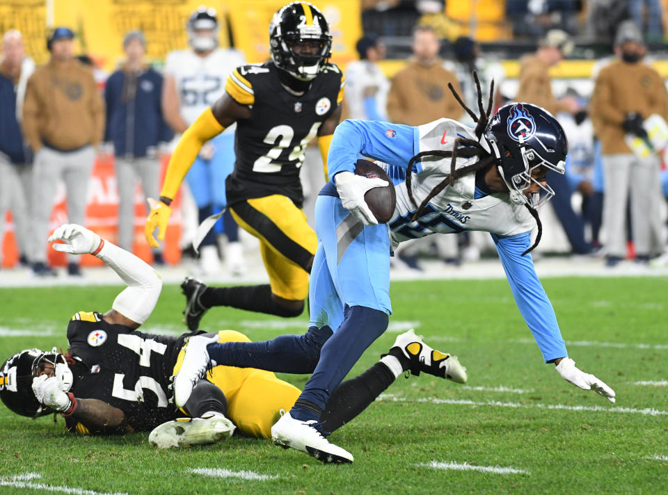 Nov 2, 2023; Pittsburgh, Pennsylvania, USA; Tennessee Titans wide receiver <a class="link " href="https://sports.yahoo.com/nfl/players/26650" data-i13n="sec:content-canvas;subsec:anchor_text;elm:context_link" data-ylk="slk:DeAndre Hopkins;sec:content-canvas;subsec:anchor_text;elm:context_link;itc:0">DeAndre Hopkins</a> (10) is tripped up by Pittsburgh Steelers linebacker <a class="link " href="https://sports.yahoo.com/nfl/players/28512" data-i13n="sec:content-canvas;subsec:anchor_text;elm:context_link" data-ylk="slk:Kwon Alexander;sec:content-canvas;subsec:anchor_text;elm:context_link;itc:0">Kwon Alexander</a> (54) during the second quarter at Acrisure Stadium. Mandatory Credit: Philip G. Pavely-USA TODAY Sports