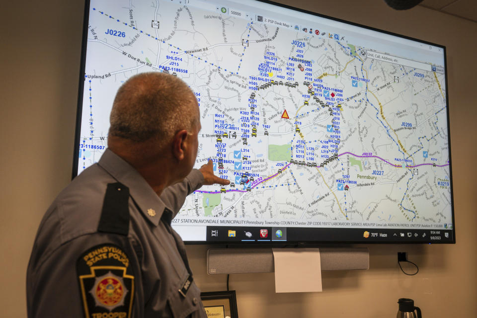 Lt. Col George Vivens shows th map of the area delineated by law enforcement and their vehicles, during a media tour, at the Incident Command Center Where Pennsylvania State Troopers, U.S. Border Patrol, Chester County Emergency Management, and FBI are collaborating on the intergovernmental manhunt searching for escaped inmate Danelo Cavalcante, at the Po-Mar-Lin Fire Company, in Unionville, Pa., Friday, Sept. 8, 2023. (Jessica Griffin/The Philadelphia Inquirer via AP)