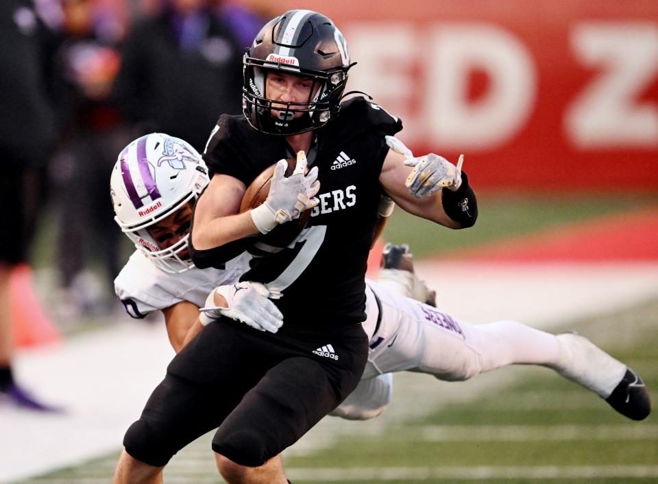 Corner Canyon’s Bryton Brady sheds Lehi’s Ezaiah Mama after a long run as they play in high school football semifinal action at Rice-Eccles Stadium in Salt Lake City on Friday, Nov. 10, 2023. Corner Canyon won 63-24. | Scott G Winterton, Deseret News